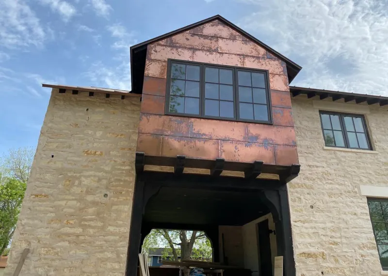 Copper metal panel facade on a stone building for Metal Roof Coating in Herkimer